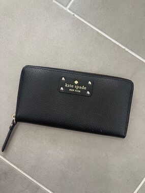 kate spade black zip-around leather wallet with gold logo